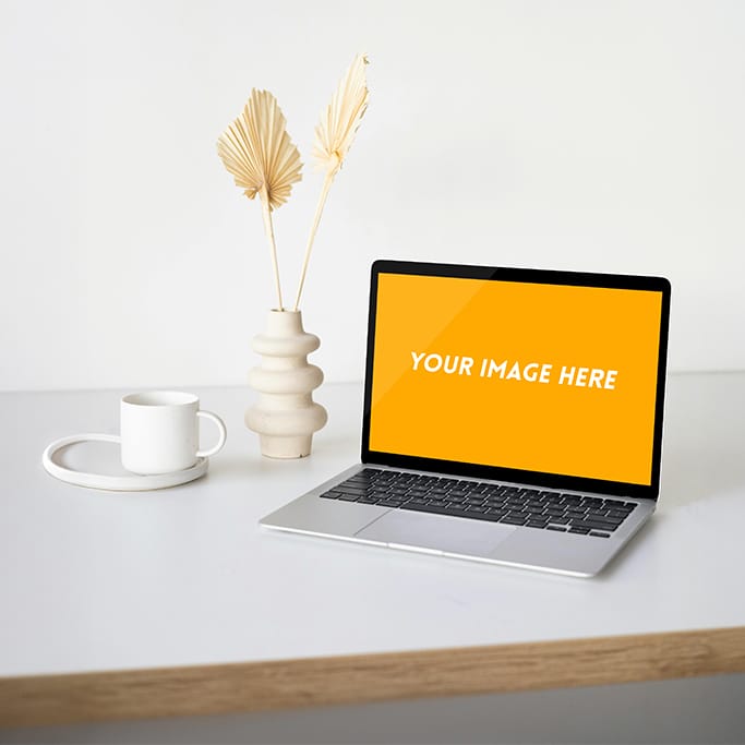 Free MacBook mockup PSD featuring a customizable screen and background, ideal for showcasing website, app, or branding designs in a professional, photorealistic style.
